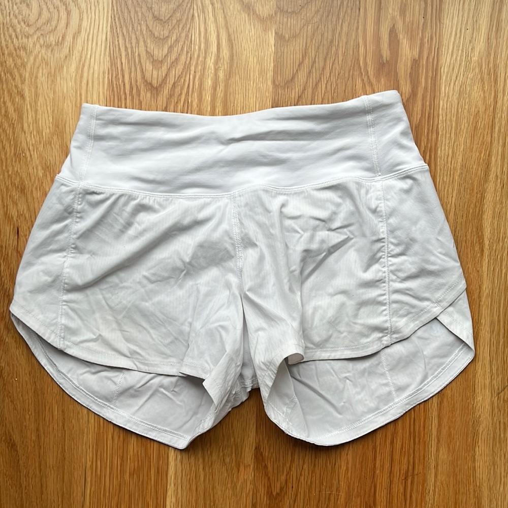 lululemon high rise, 4 inch, size two, white speed up shorts!